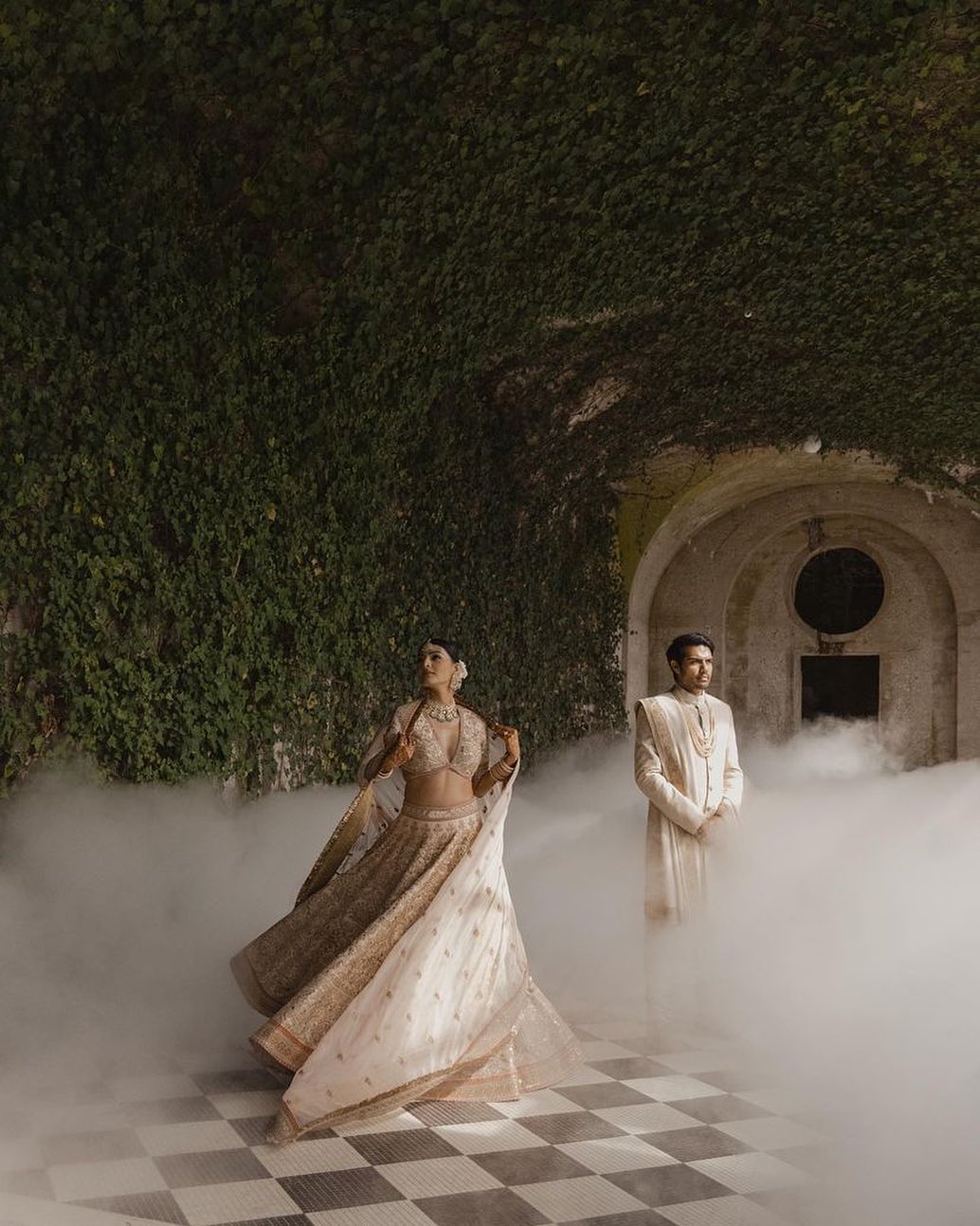 #CLADCeremonials Rekha’s blush pink heritage lehenga contains the right amount of golden glint, and hints of red to elevate the Sabyasachi ensemble. Akshay’s ivory sherwani is dapper, but the highlight is a tussar georgette shawl adorned with zari marori embroidered borders. Brown leather loafers complete the look for the gorgeous CLAD couple.
Styling: @tanster24 / @clad.clad
Interview: @fawziakhan
Jewellery: @birdhichand
Photography: @milighosh
Makeup: @cherishbrookehill
Hair: @owengould
Decor: @prashe
Mehendi: @hennaartbyhiral
Draping: @karunachani
.
.
.
.
.
.
.
#clad #cladgroom #newyorkwedding #indianwedding #wedding #newyork #indianbride #mehendi #bride #cladbrides #shaadi #sangeetnight #sabysachi #weddingdecor #weddingphotography #weddingstyling